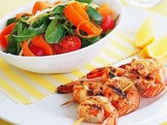 A light, healthy salad with barbecued prawn kebabs